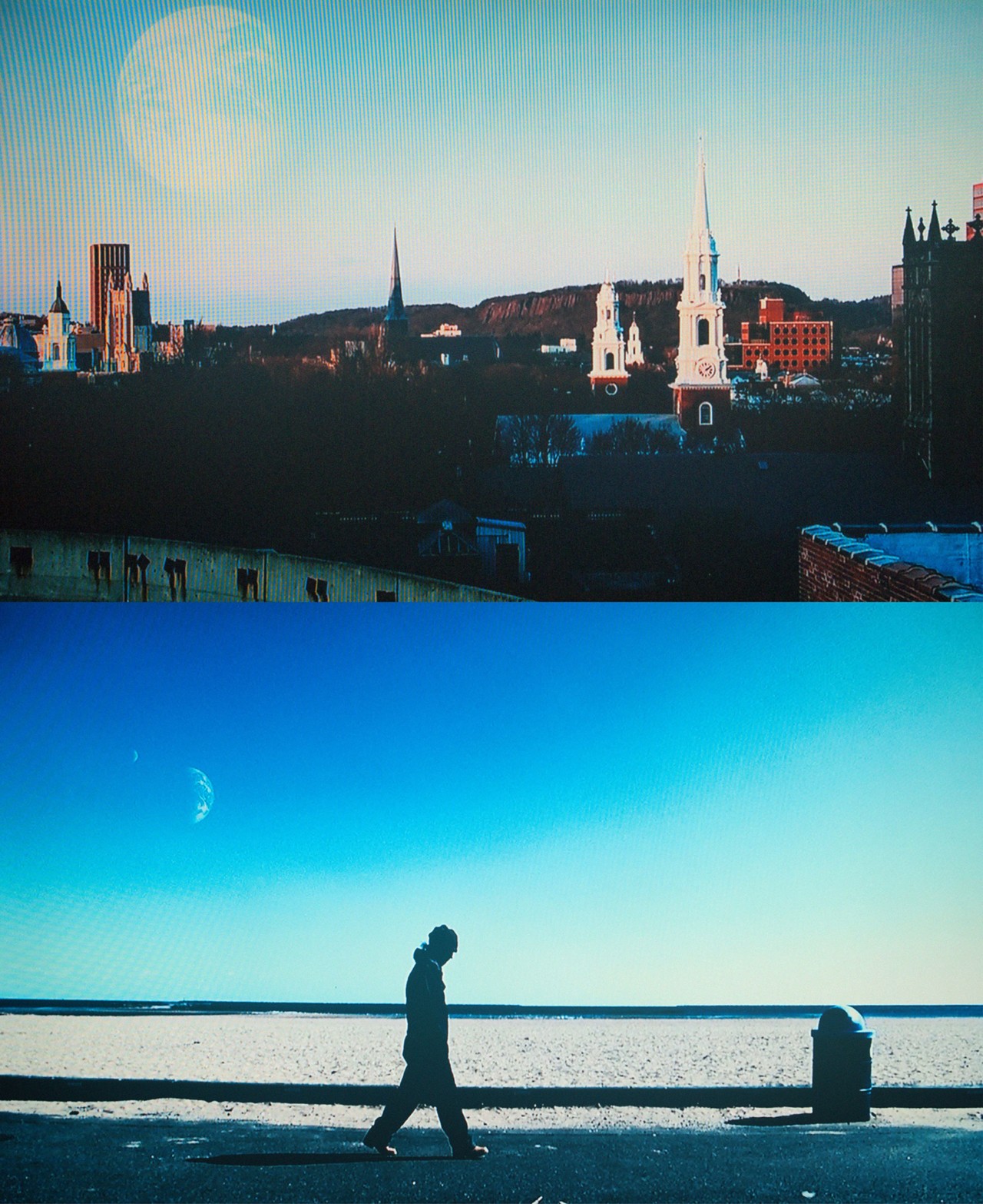 Scene of town and person on beach from Another Earth