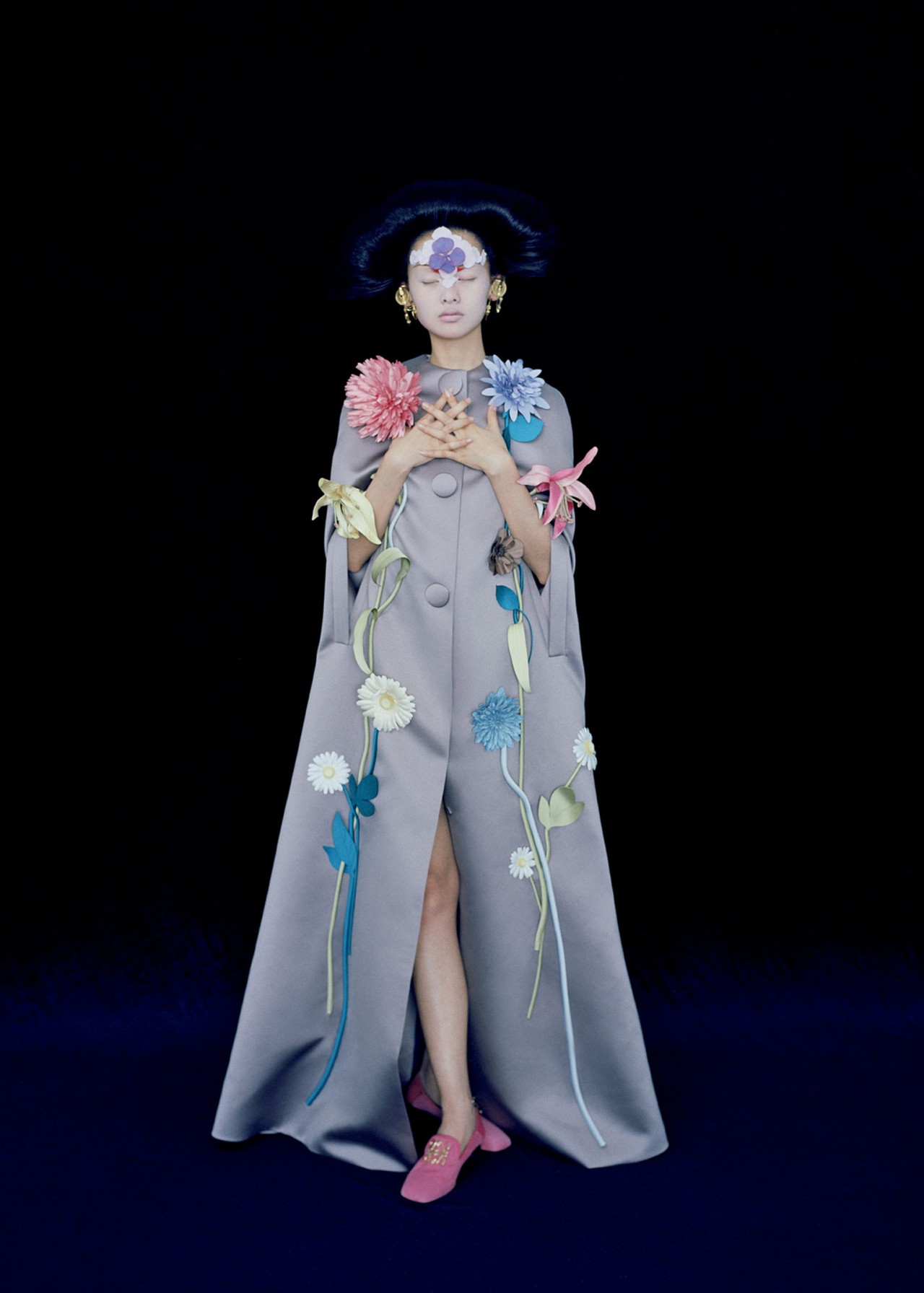 Model wears a Viktor and Rolf Couture cape in Shanghai by Leslie Zhang