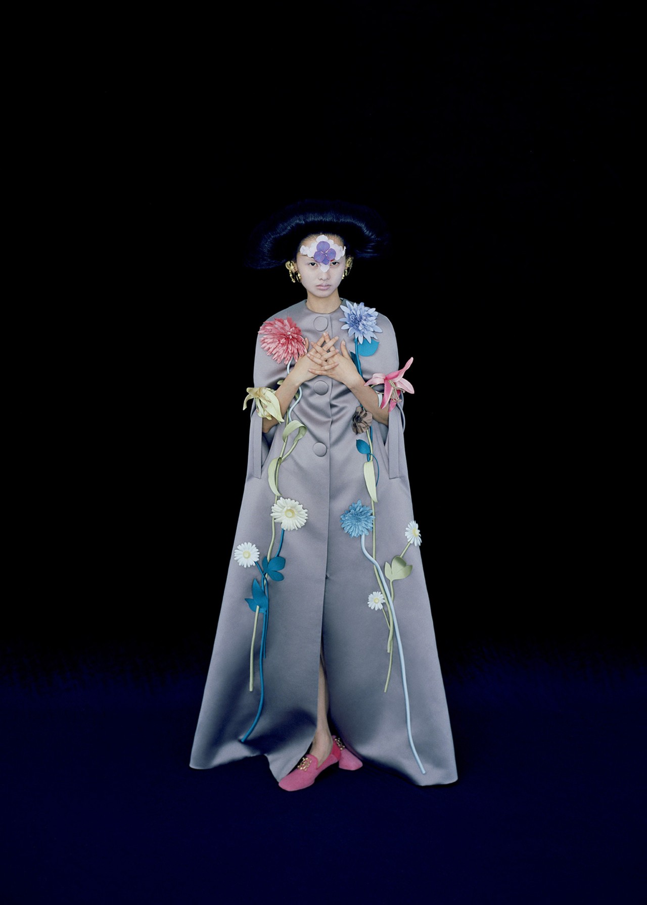 Model wears a Viktor and Rolf Couture cape in Shanghai by Leslie Zhang