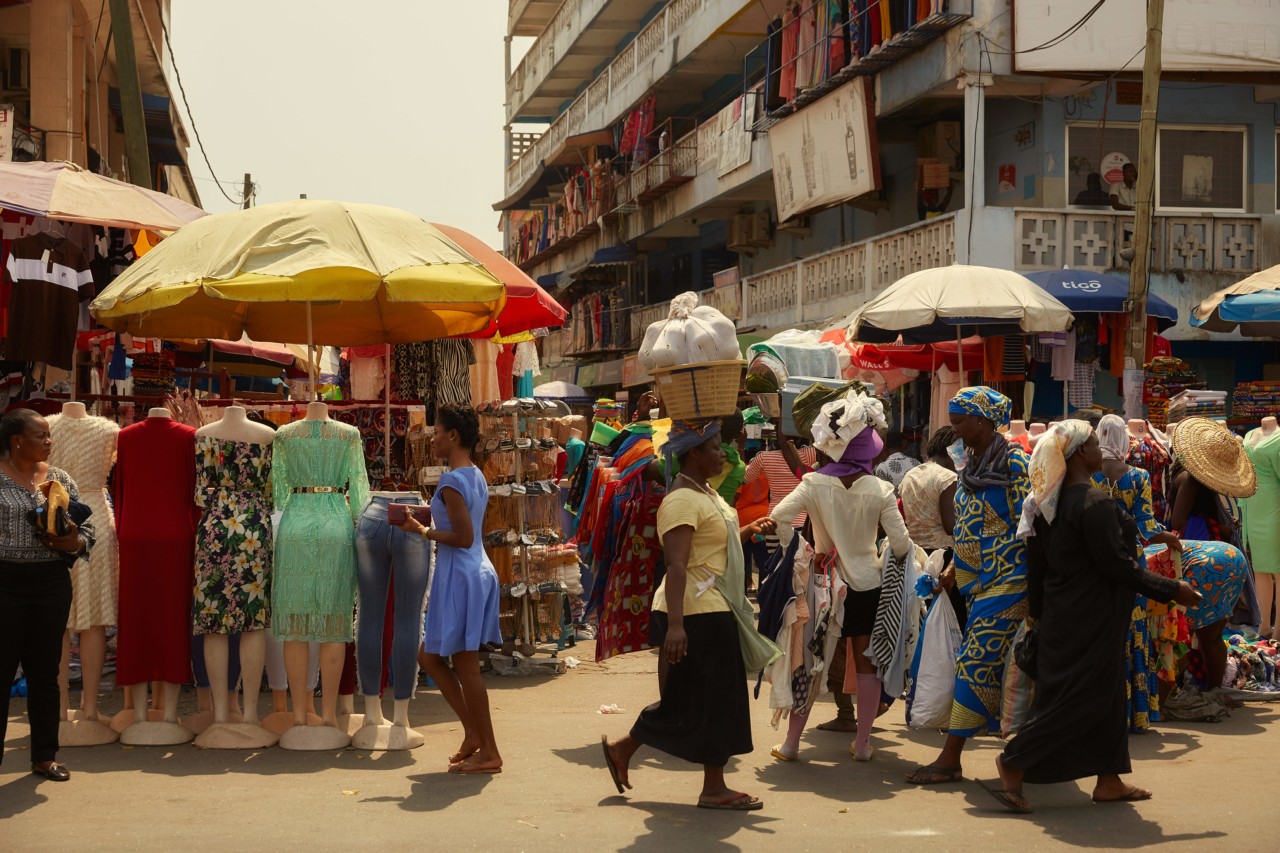 Retailers and customers in Kantamanto market in Accra Ghana by Charlie Engman