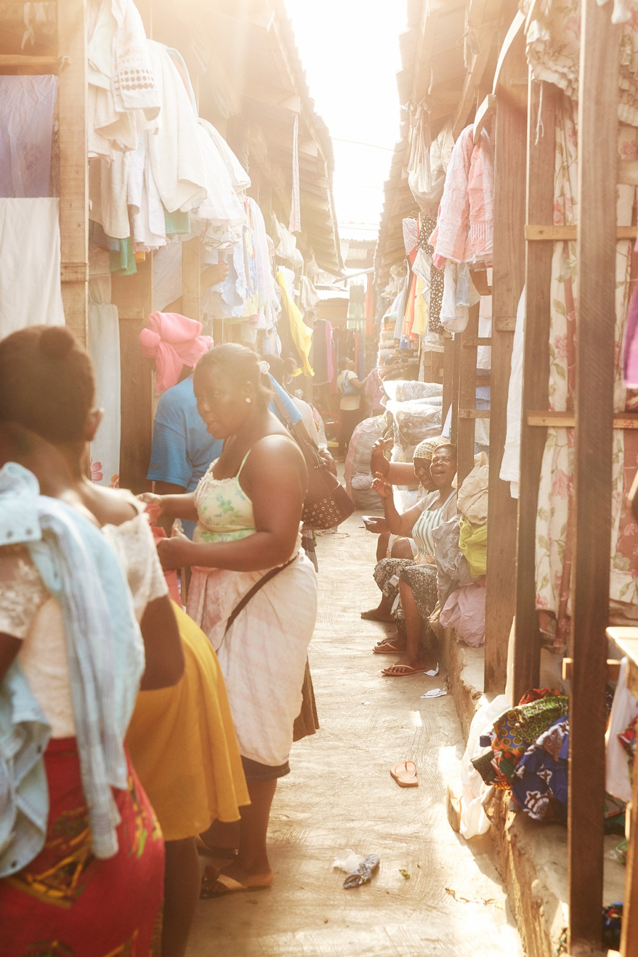 Retailers and customers in Kantamanto market in Accra Ghana by Charlie Engman