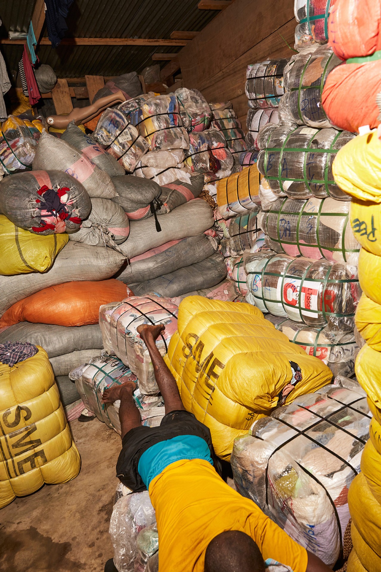 Bales of second hand clothing in Kantamanto market in Accra Ghana by Charlie Engman