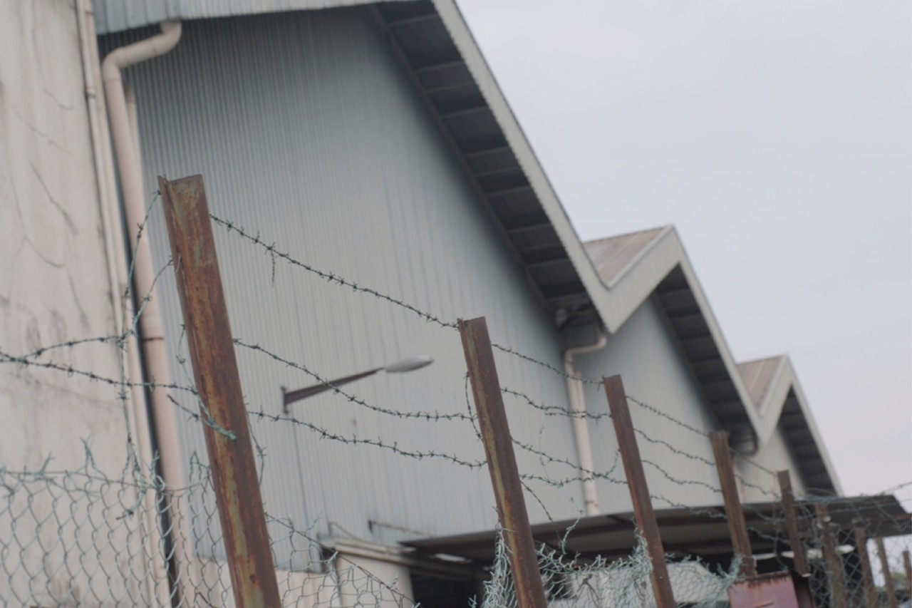 Wire surrounds a factory courtesy Transparentem