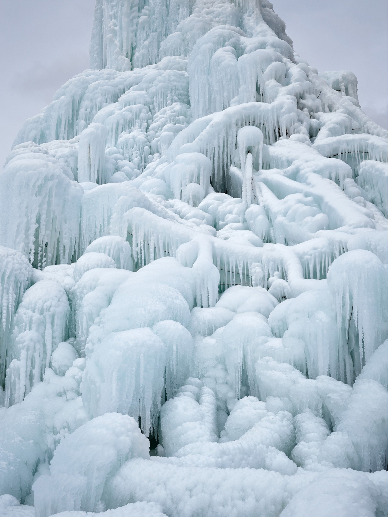 Detail of icicles on an ice stupa in Ladakh India by Greg White