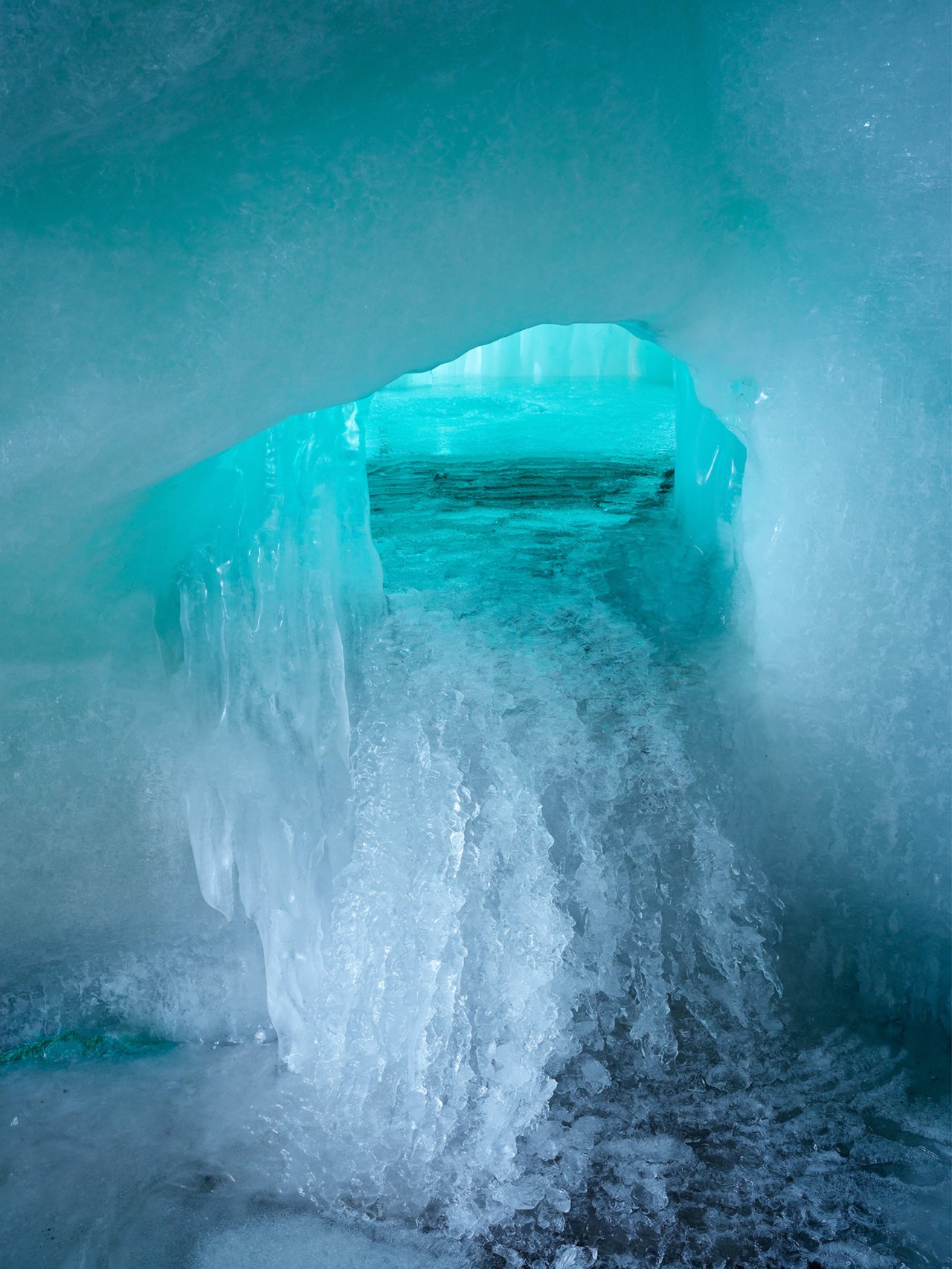 Water flowing through an ice stupa in Ladakh India by Greg White
