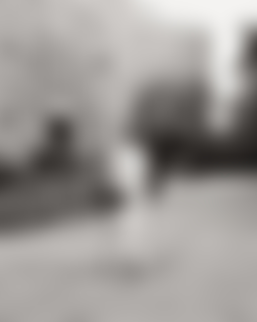 Portrait of man with skateboard in New York City by Ben Grieme