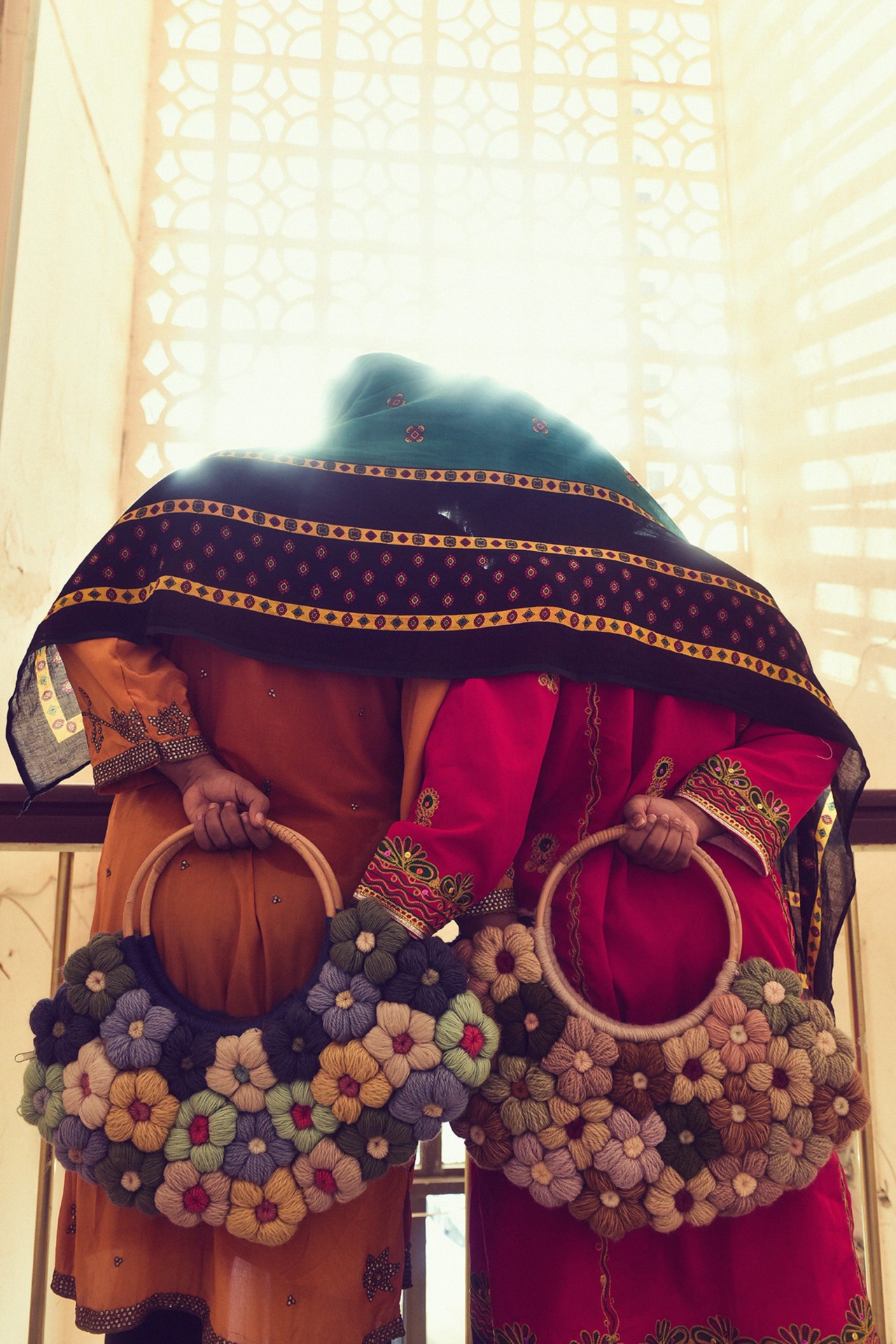 Two models wearing local fashion in Oman by Ali Al Sharji