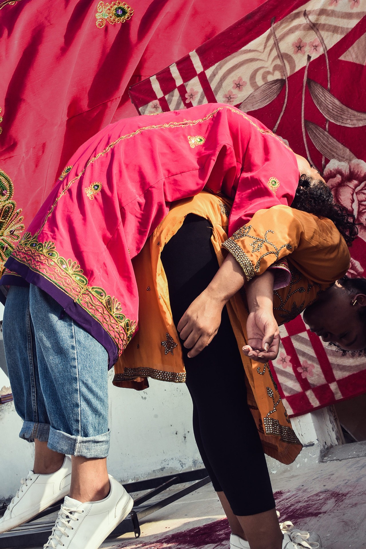 Two models in playful pose in Oman by Ali Al Sharji