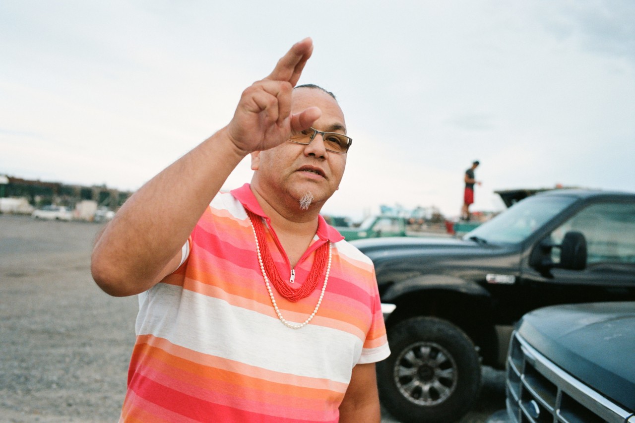 Lumni Indian Business Council Member Freddie Lane pointing at the sky by Max Farago