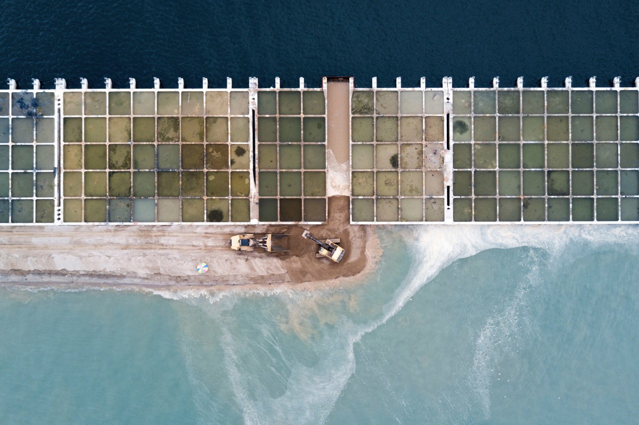 Aerial view of a pier in Tuas, Singapore built on reclaimed land by Sim Chi Yin