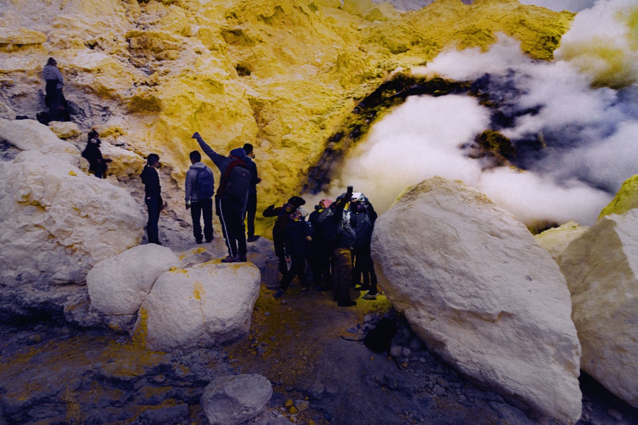 Tourists taking photos at Mt Ijen volcano in Indonesia by Rishabh Malik