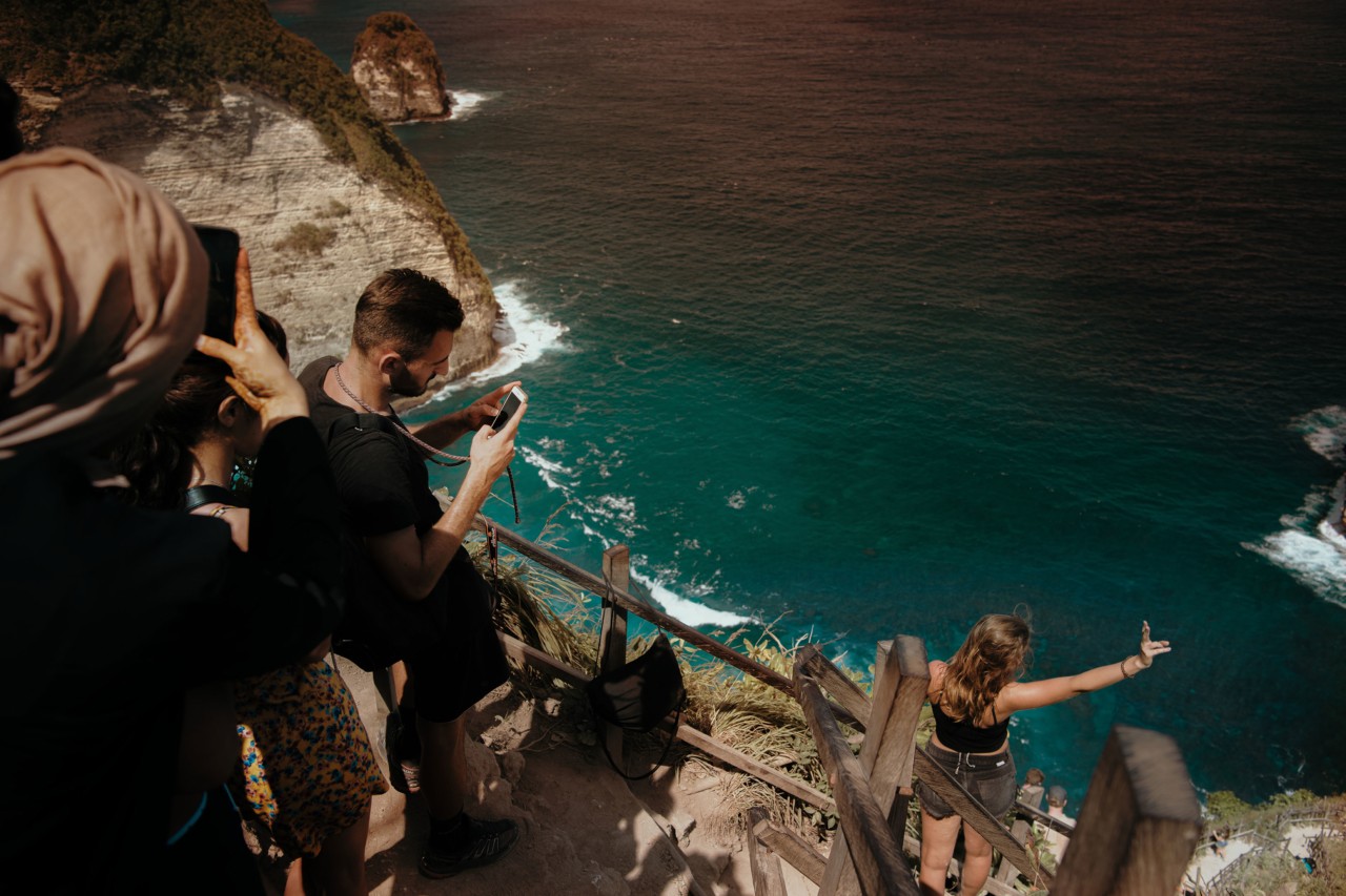 Tourists taking pictures in Nusa Penuda Indonesia by Rishabh Malik