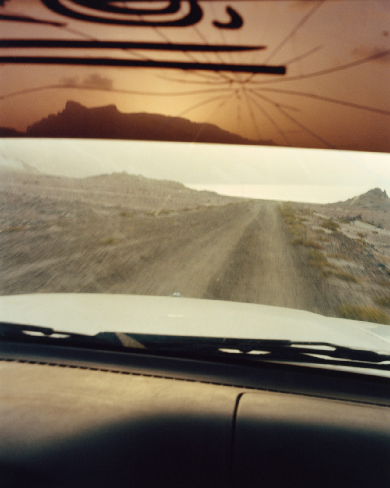 Road viewed through the windshield of a car in Socotra Yemen by Jamie Hawkesworth
