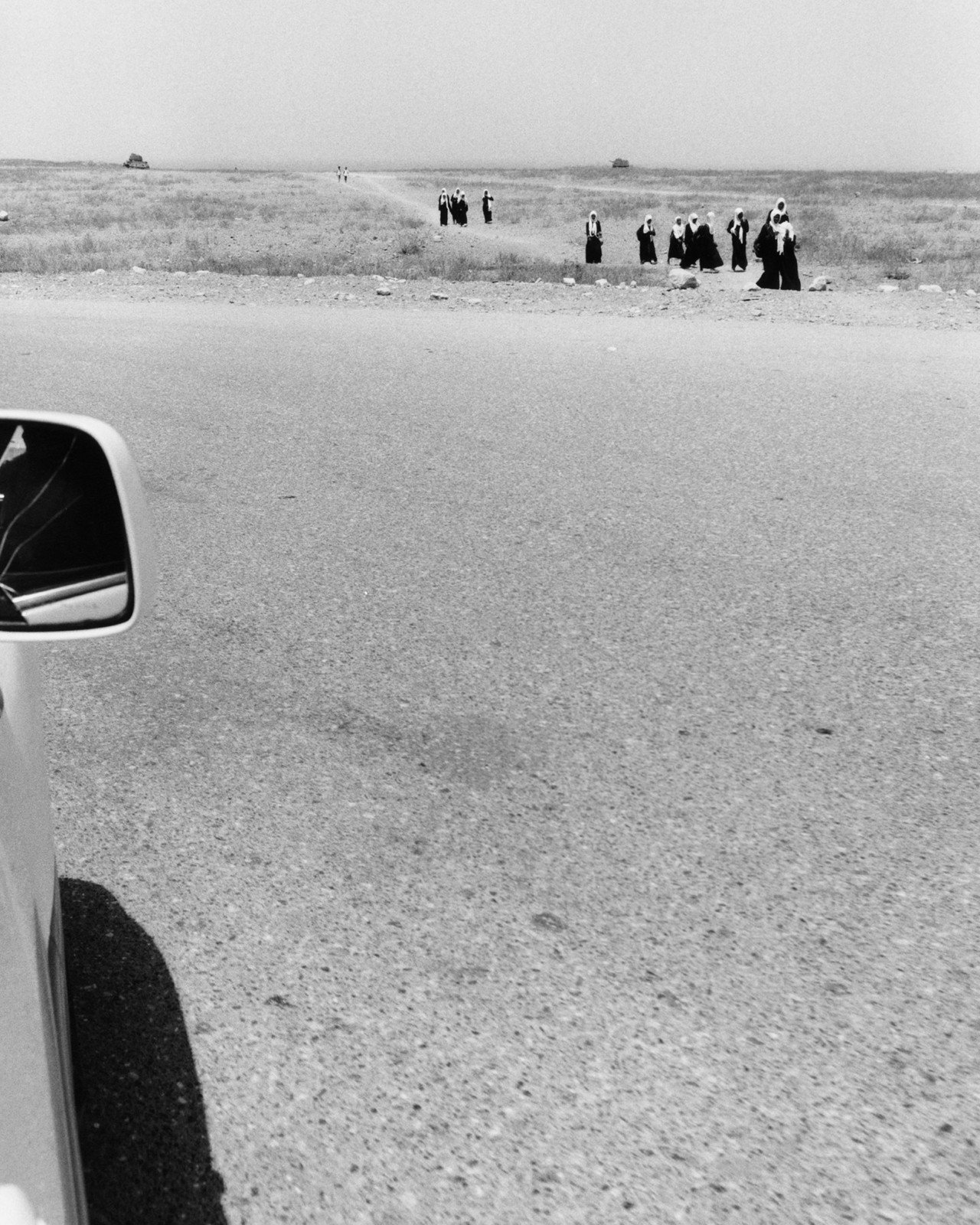 Women walking along the road in Socotra Yemen by Jamie Hawkesworth