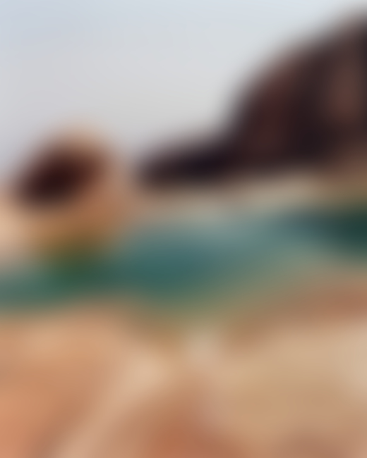 A natural pool of water on a cliffside in Socotra Yemen by Jamie Hawkesworth