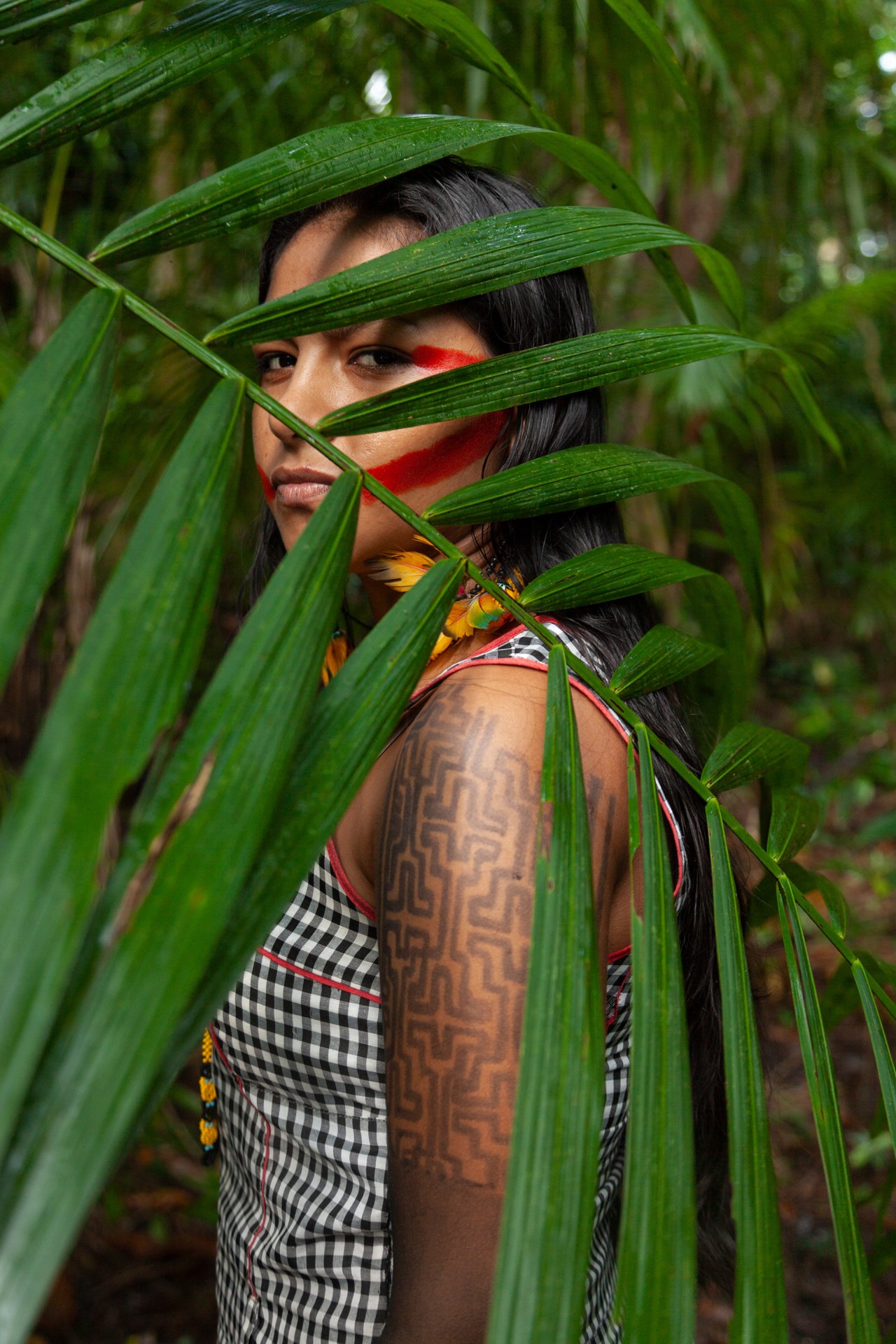 Amazon activist Juma Xipaya in the forest by Liliana Merizalde