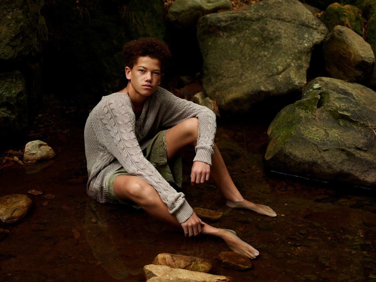 Child sitting in forest by Pieter Hugo