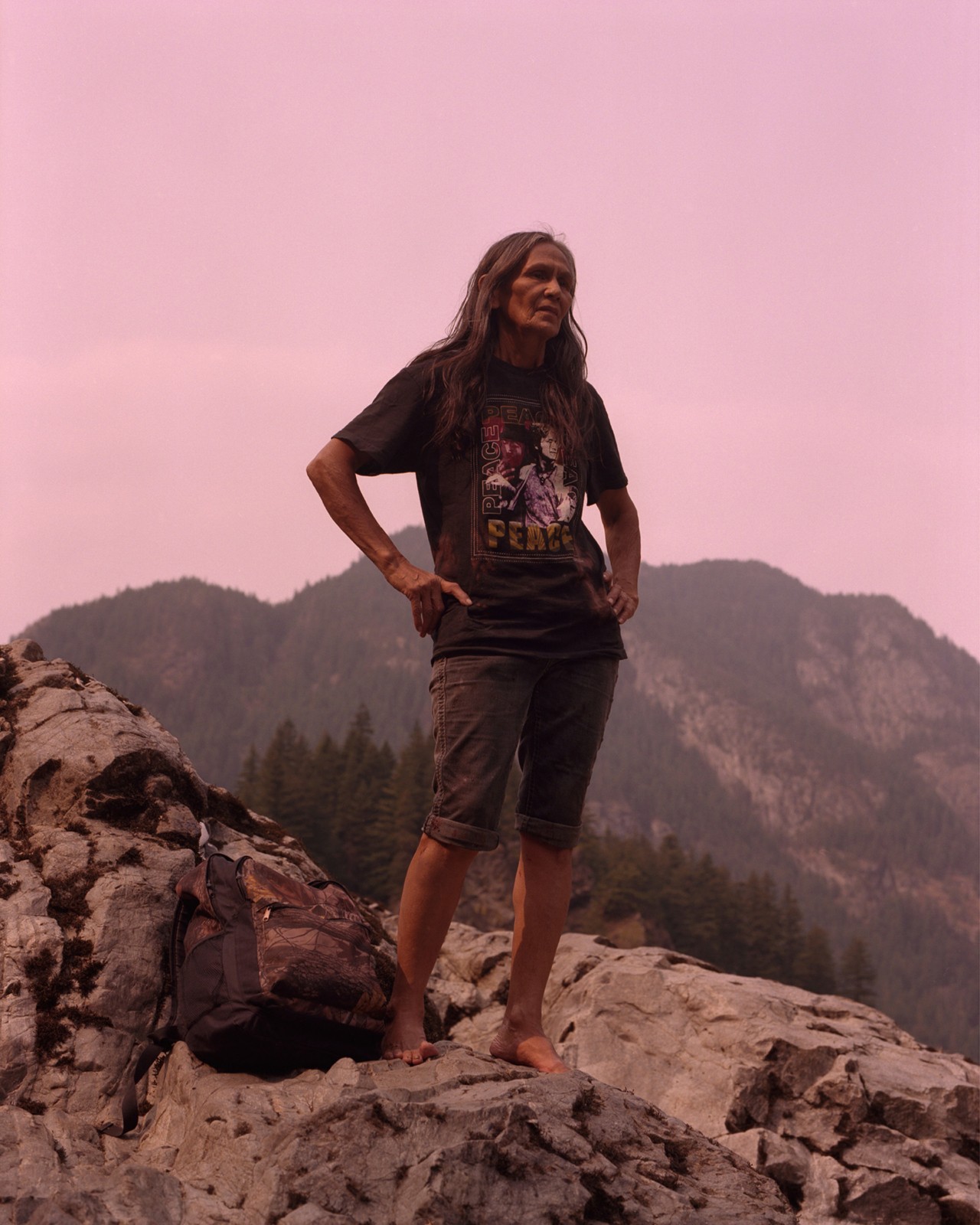 Lubicon Cree Nation woman standing on rocks by Ryan Shorosky