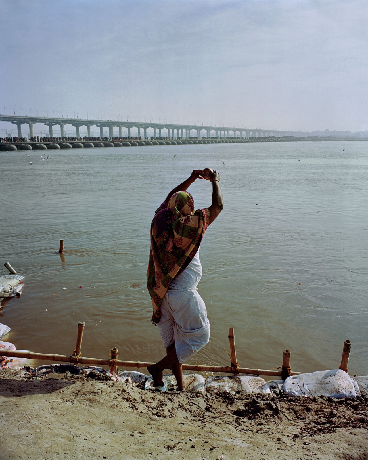 People along the Ganges River in India by Ashish Shah