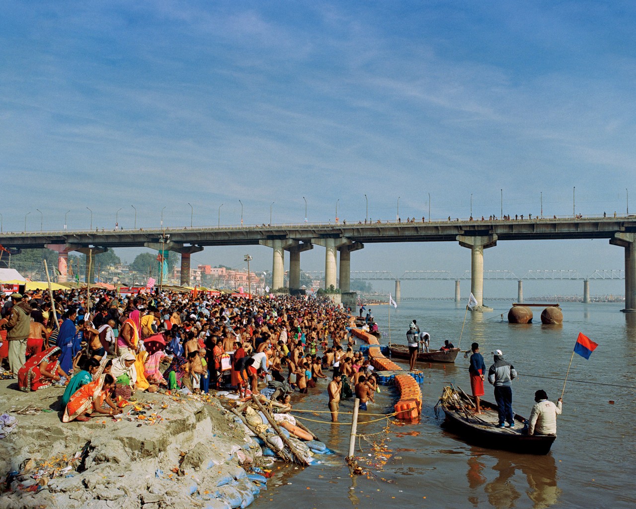 People bathing along the Ganges River in India by Ashish Shah