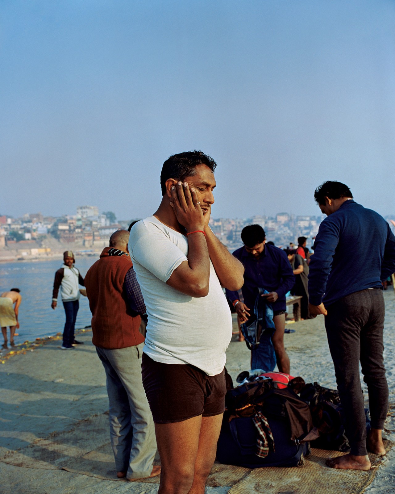 People bathing along the Ganges River in India by Ashish Shah
