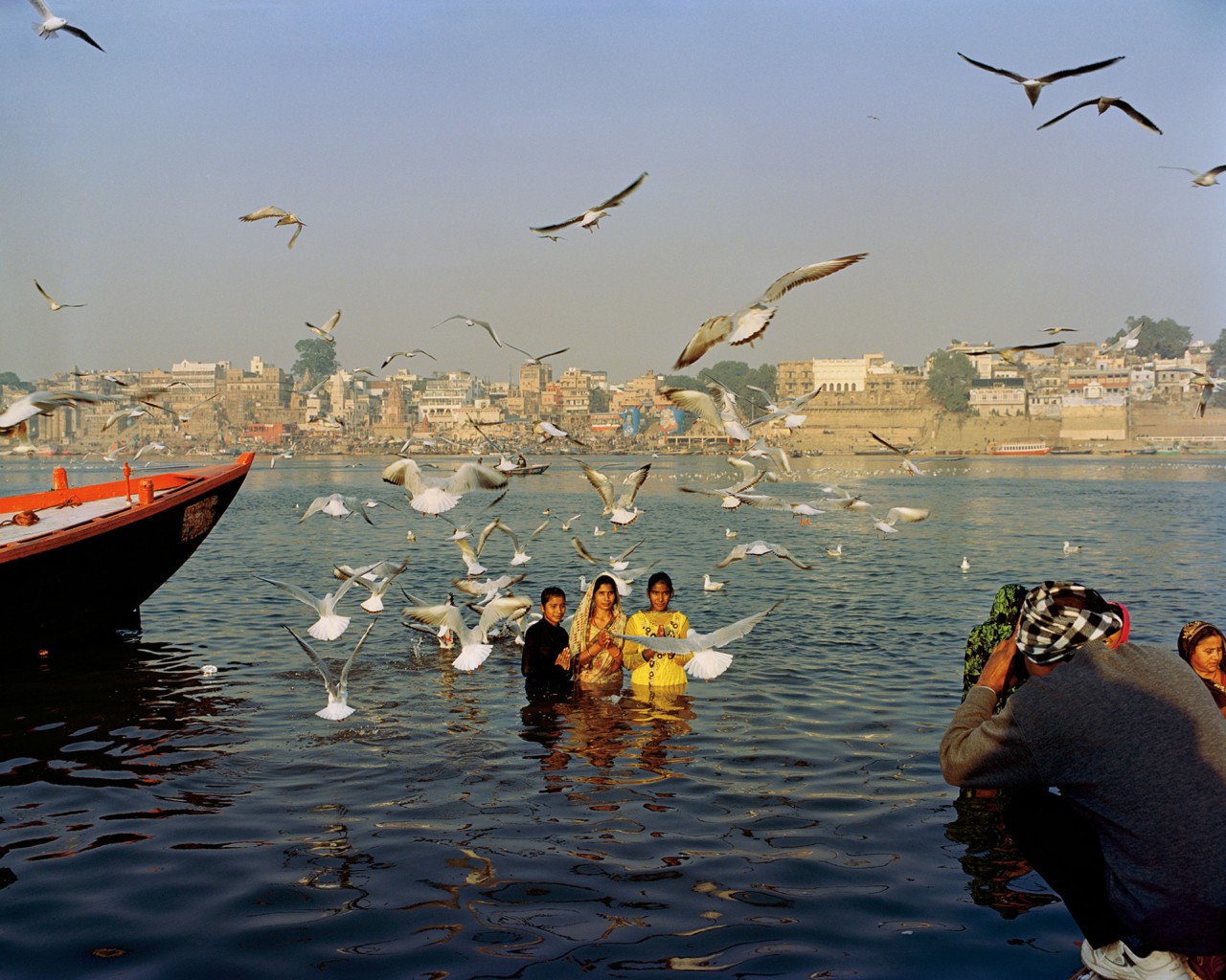 People along the Ganges River in India by Ashish Shah