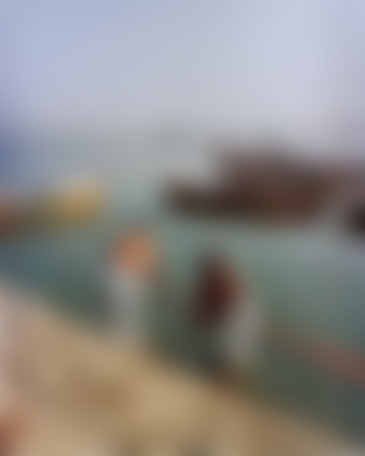 People along the Ganges River in India by Ashish Shah
