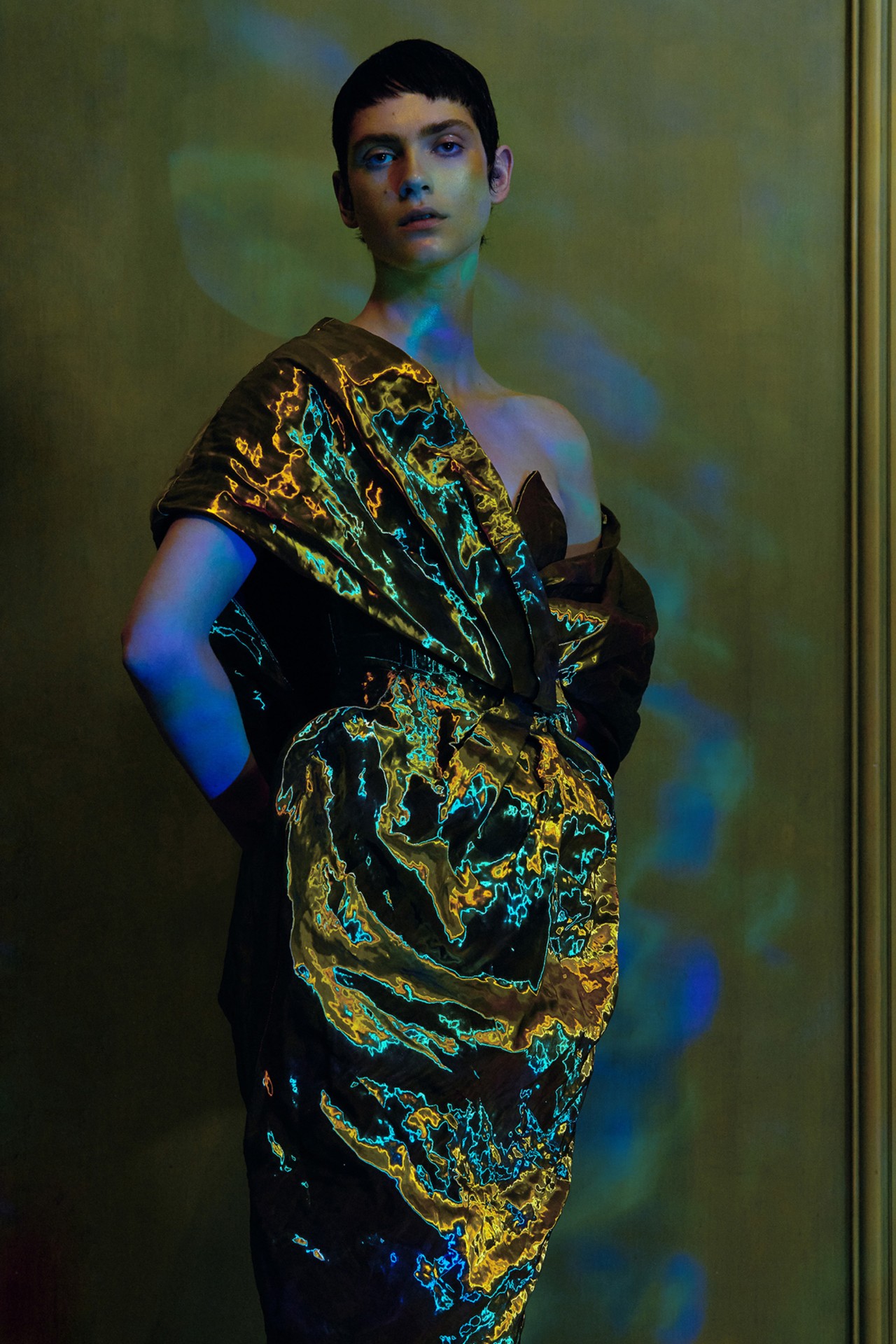 Model in gold green blue dress by Alexandra Von Fuerst