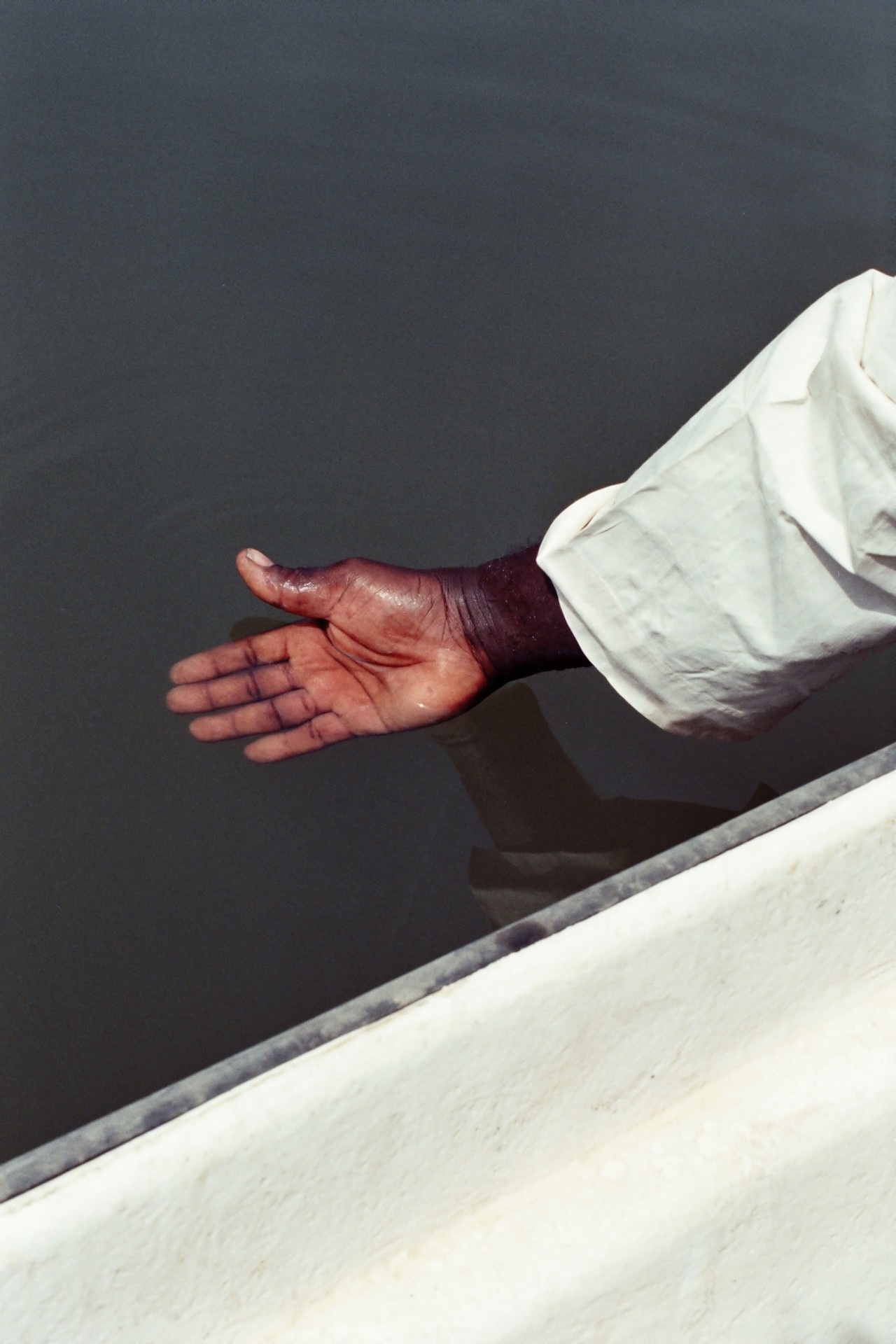 Salatou Sambou river watcher hand by Denisse Ariana Pérez