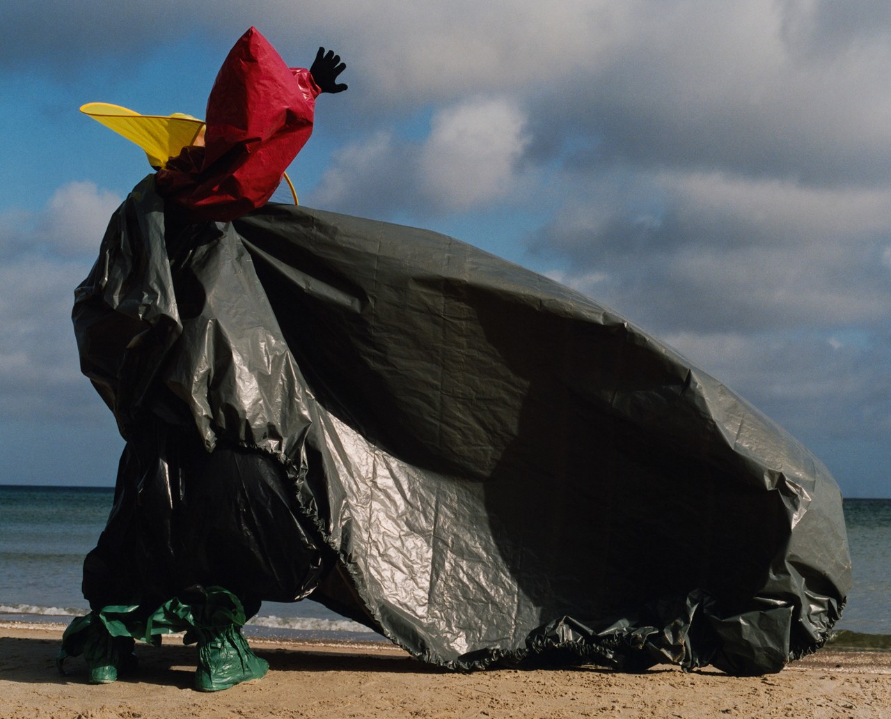 Black trash bag styling on model by Luis Alberto Rodriguez