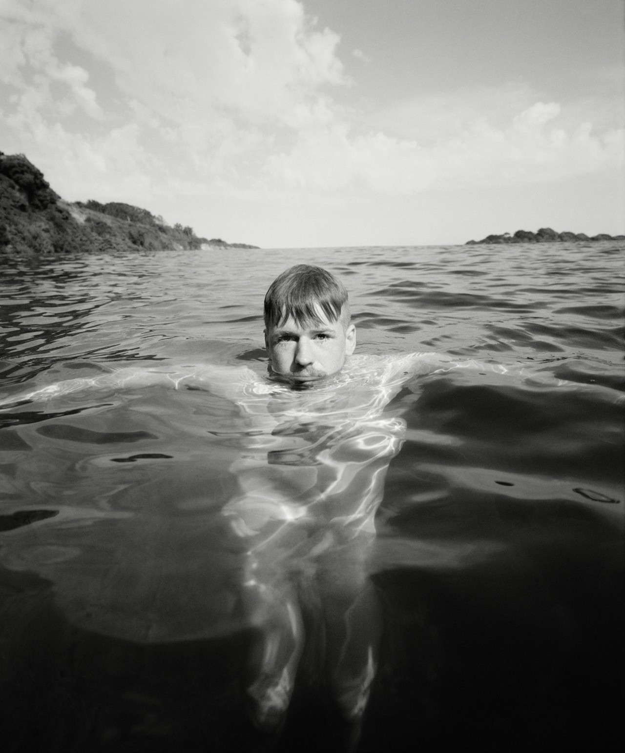 Nude model swimming in Cornwall by Ben Toms