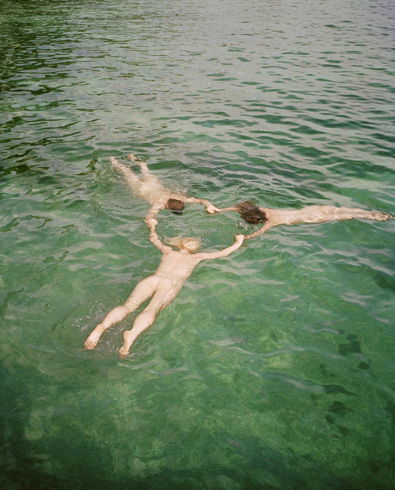 Nude models swimming in Cornwall by Ben Toms