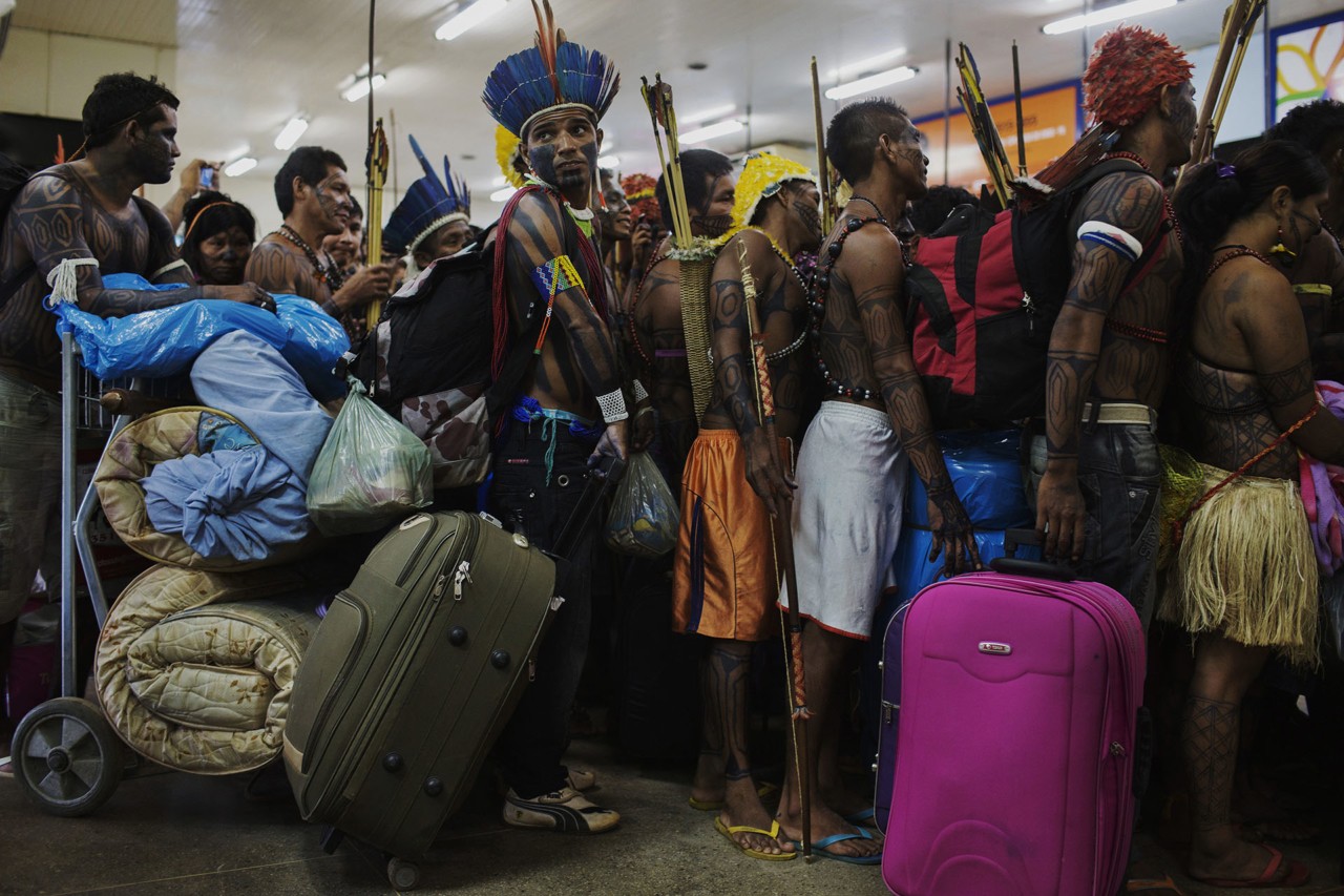 Brazilian people standing in line for travel by Lalo de Almeida