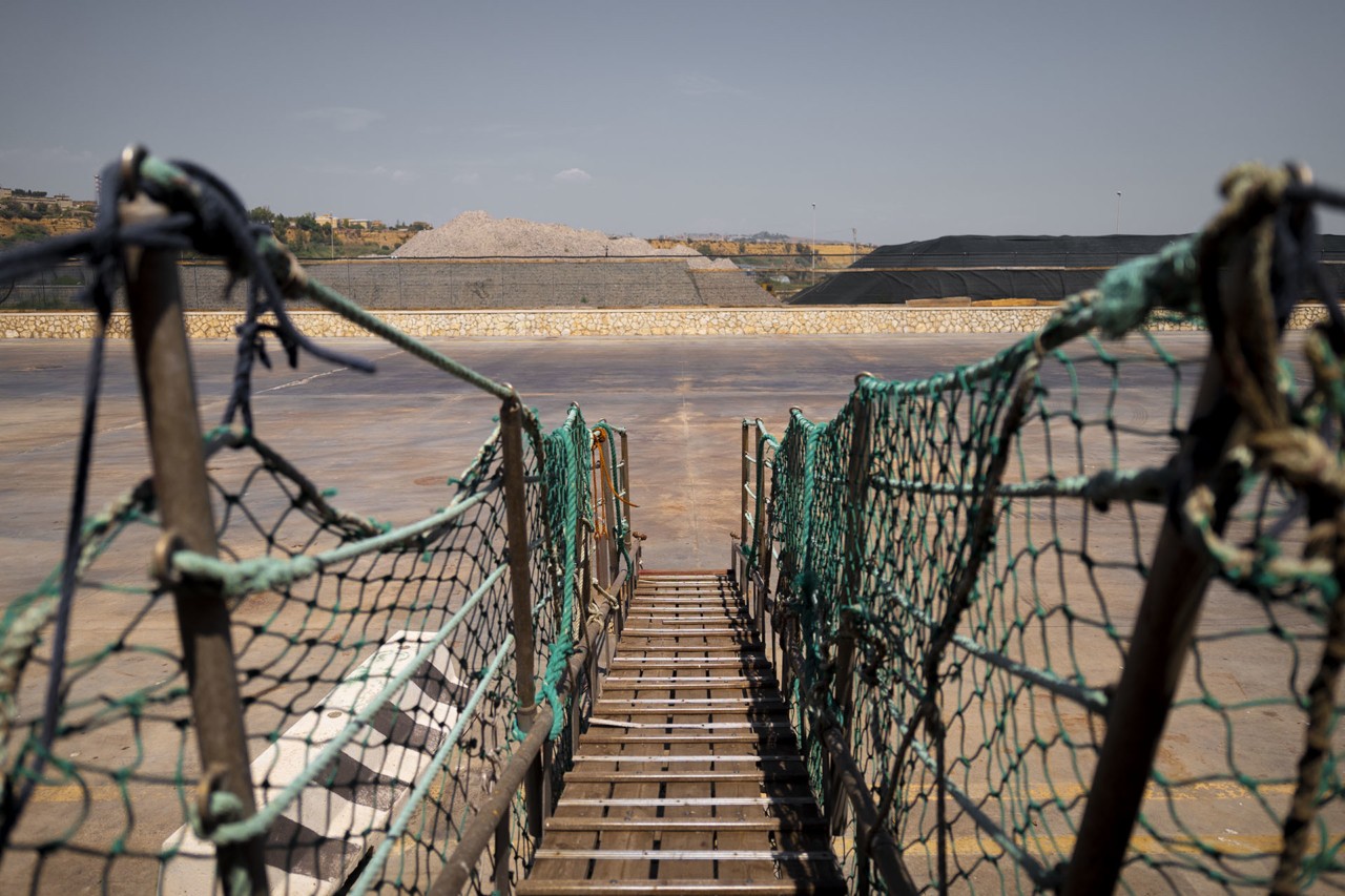 Green walkway Blue cargo shipment by Alessia Rollo