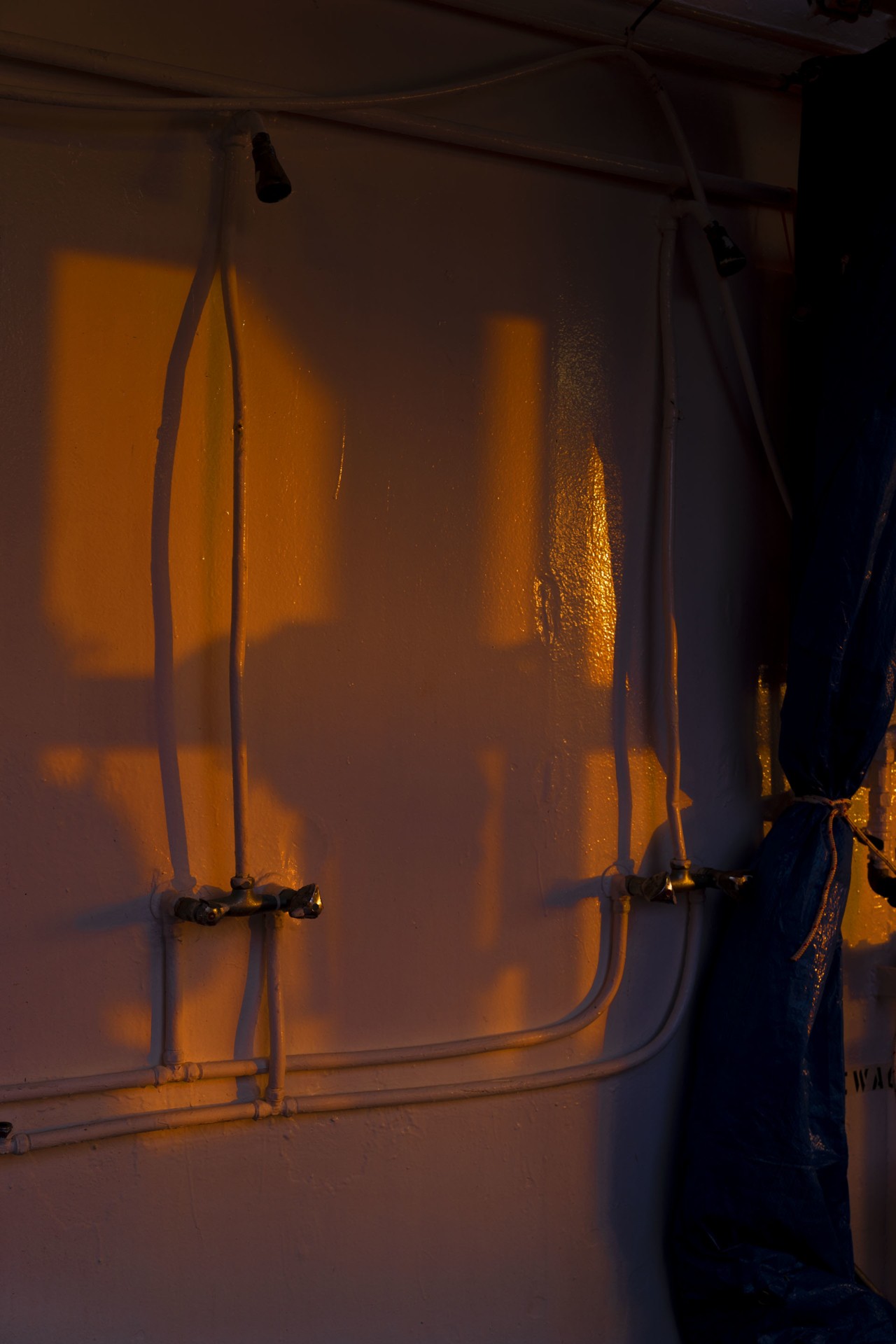 Ship at sunset Blue cargo shipment by Alessia Rollo