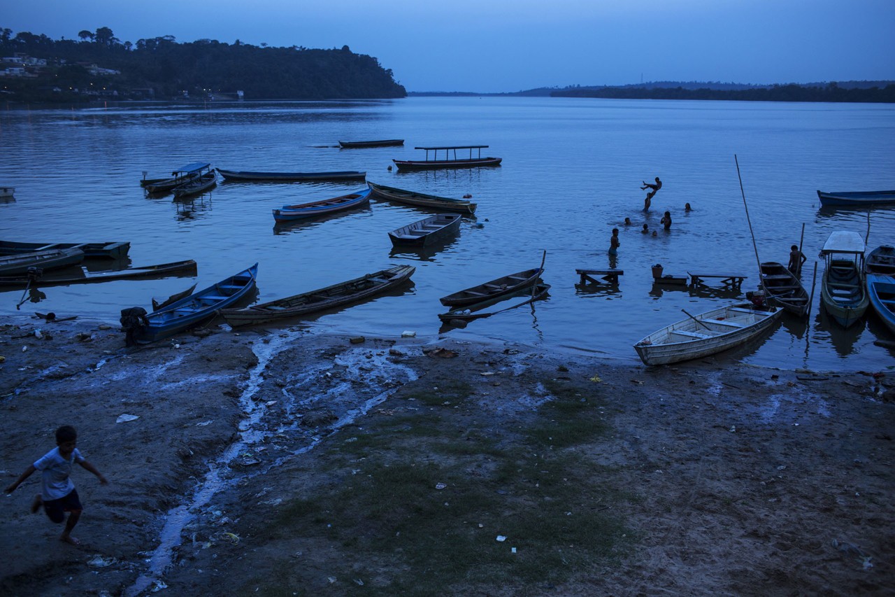 Boats in Xingu River in Altamira, Para in Brazil by Lalo de Almeida