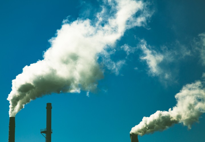 Fossil fuel smoke and pollution at Irving Pulp and Paper Mill at Reversing Falls, Saint John in New Brunswick, Canada