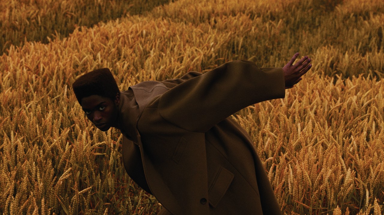 Person in yellow field by Jumbo Tsui