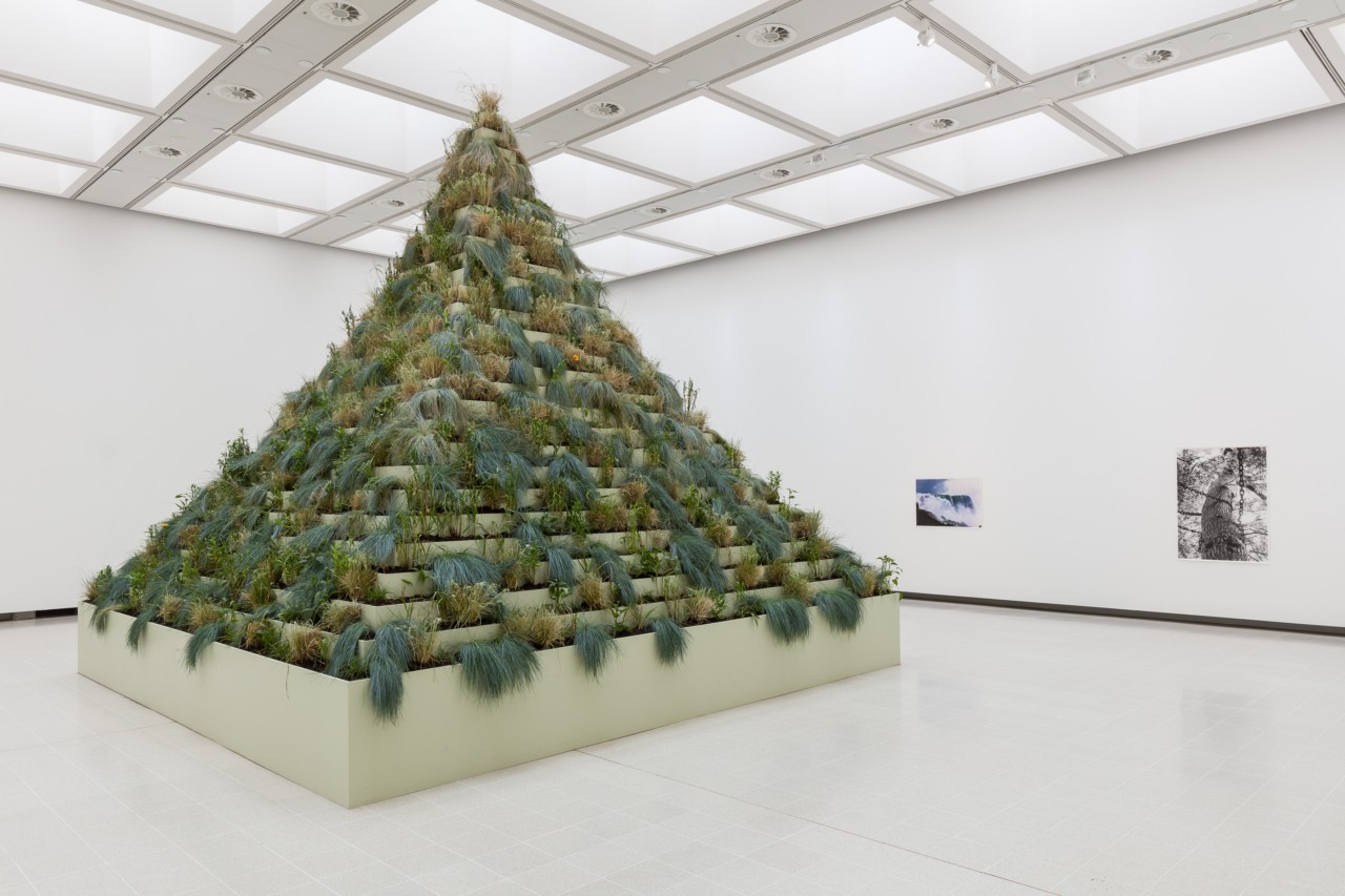 A large, pyramid shaped art installation sits in the middle of a room at the Hayward Gallery.