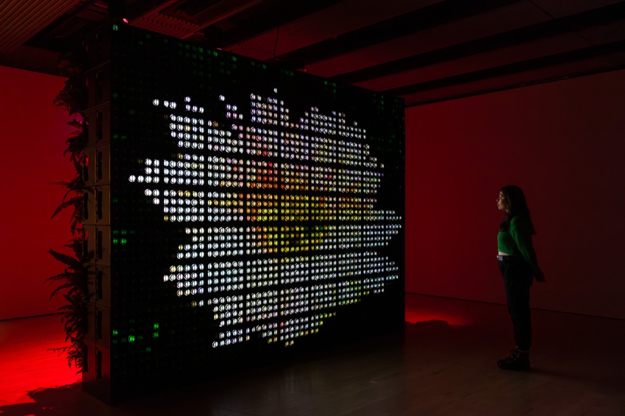 A woman looks at a large black and white art installation at the Hayward Gallery.