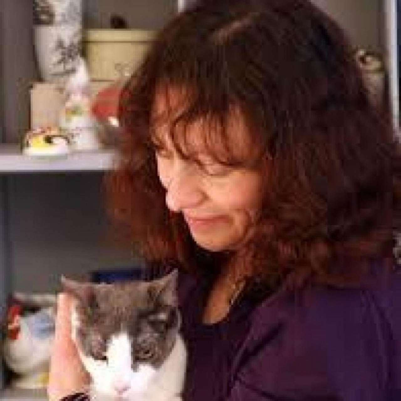Michele C. Hollow holding her cat.