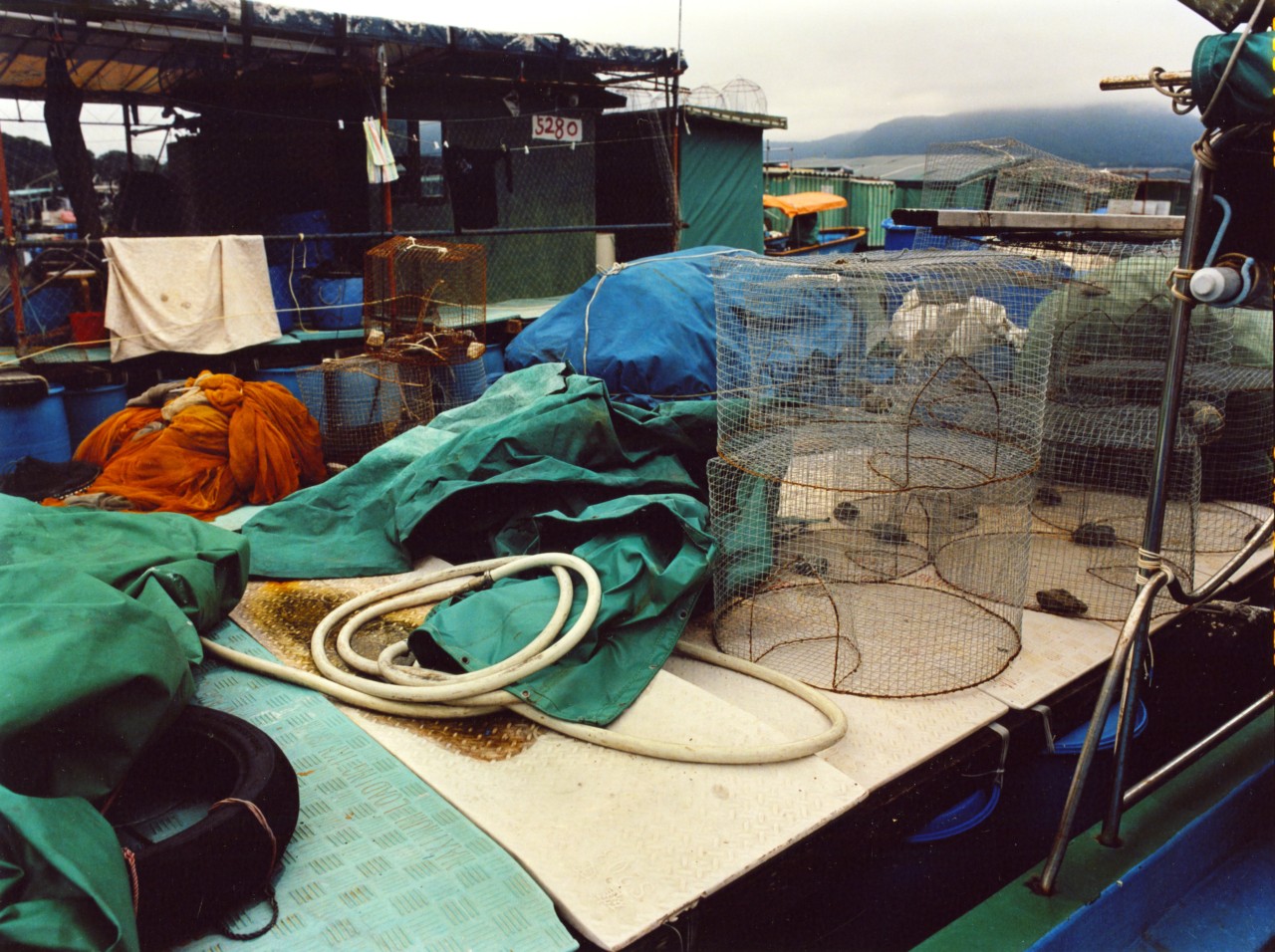 Blue and green tarp sits on a dock.