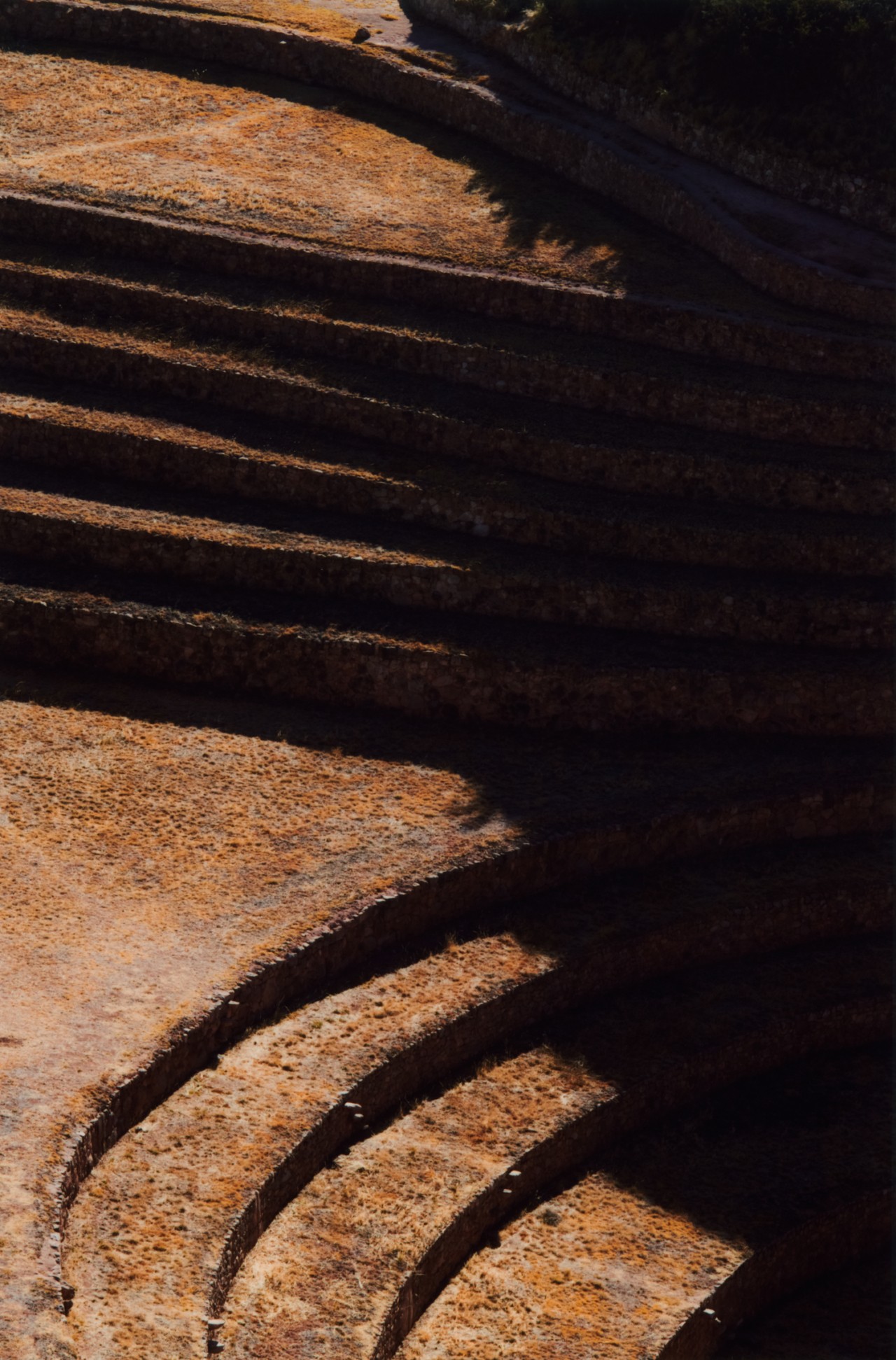 The light and shadows meet on stoney staircase.