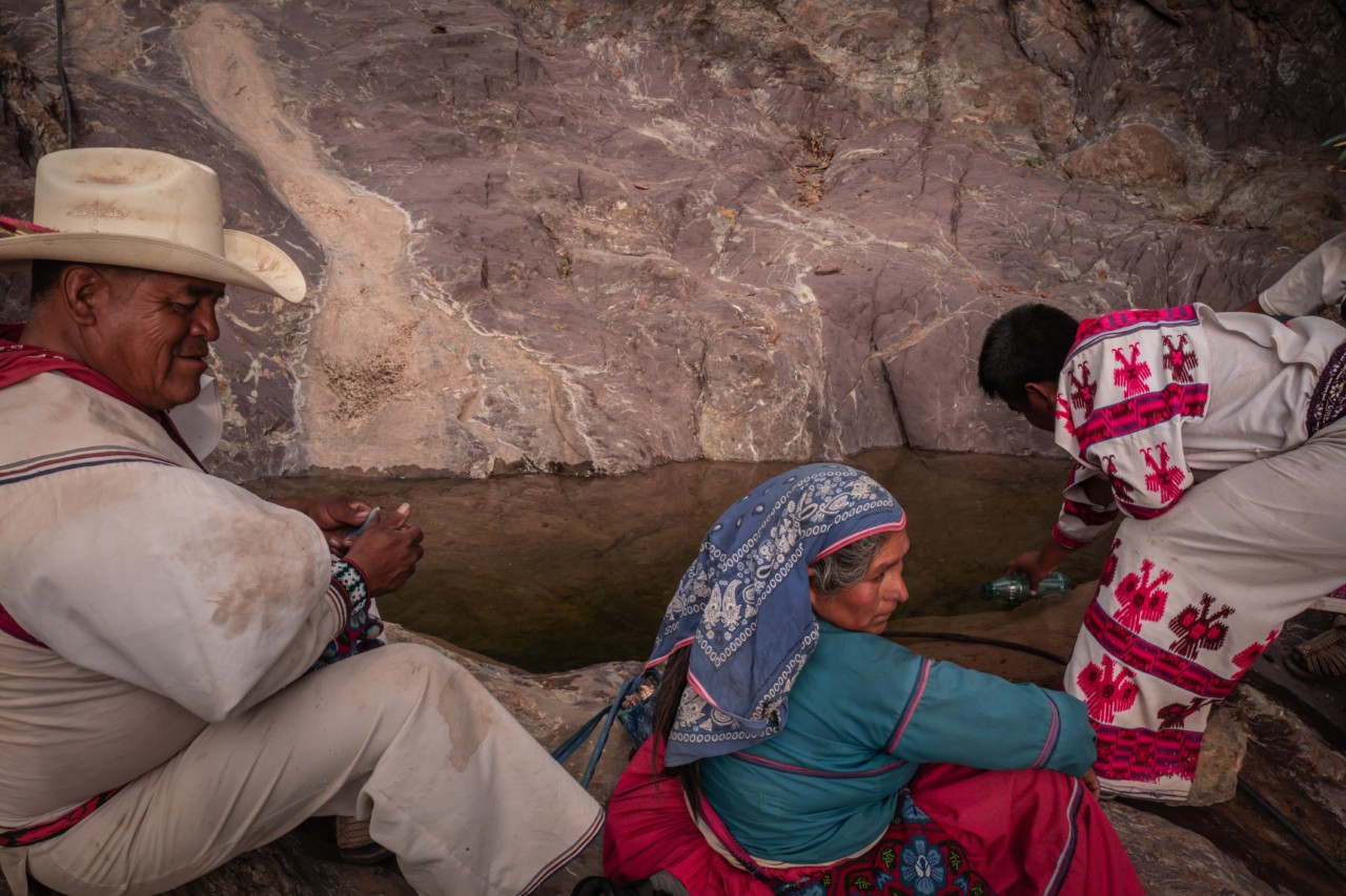 Three peyote guardians sitting near a source of water in Wirikuta, Mexico.