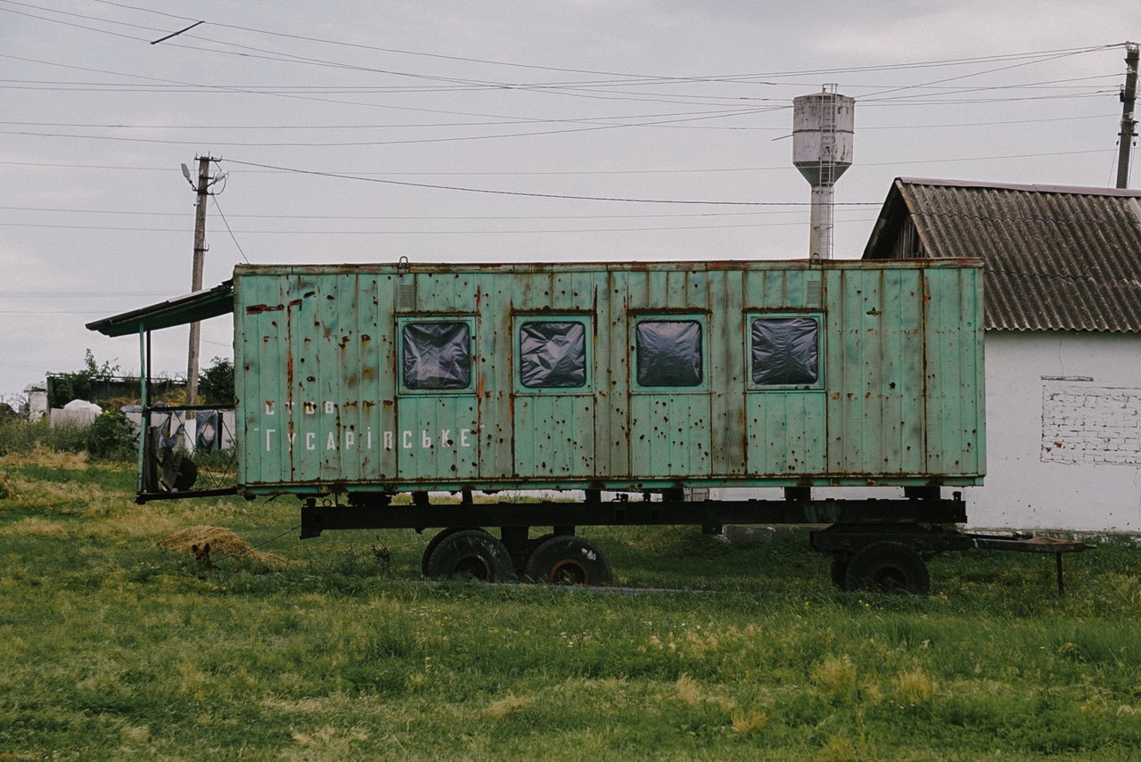 Bullet holes dot a vacant wagon on a Ukrainian farm.
