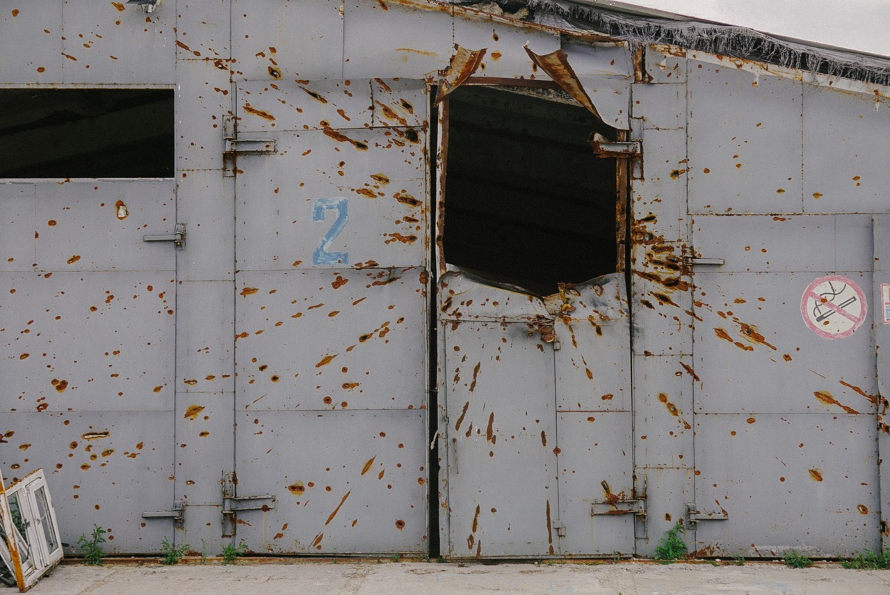 A missile shelling blasted a gaping hole in a large shipping container.