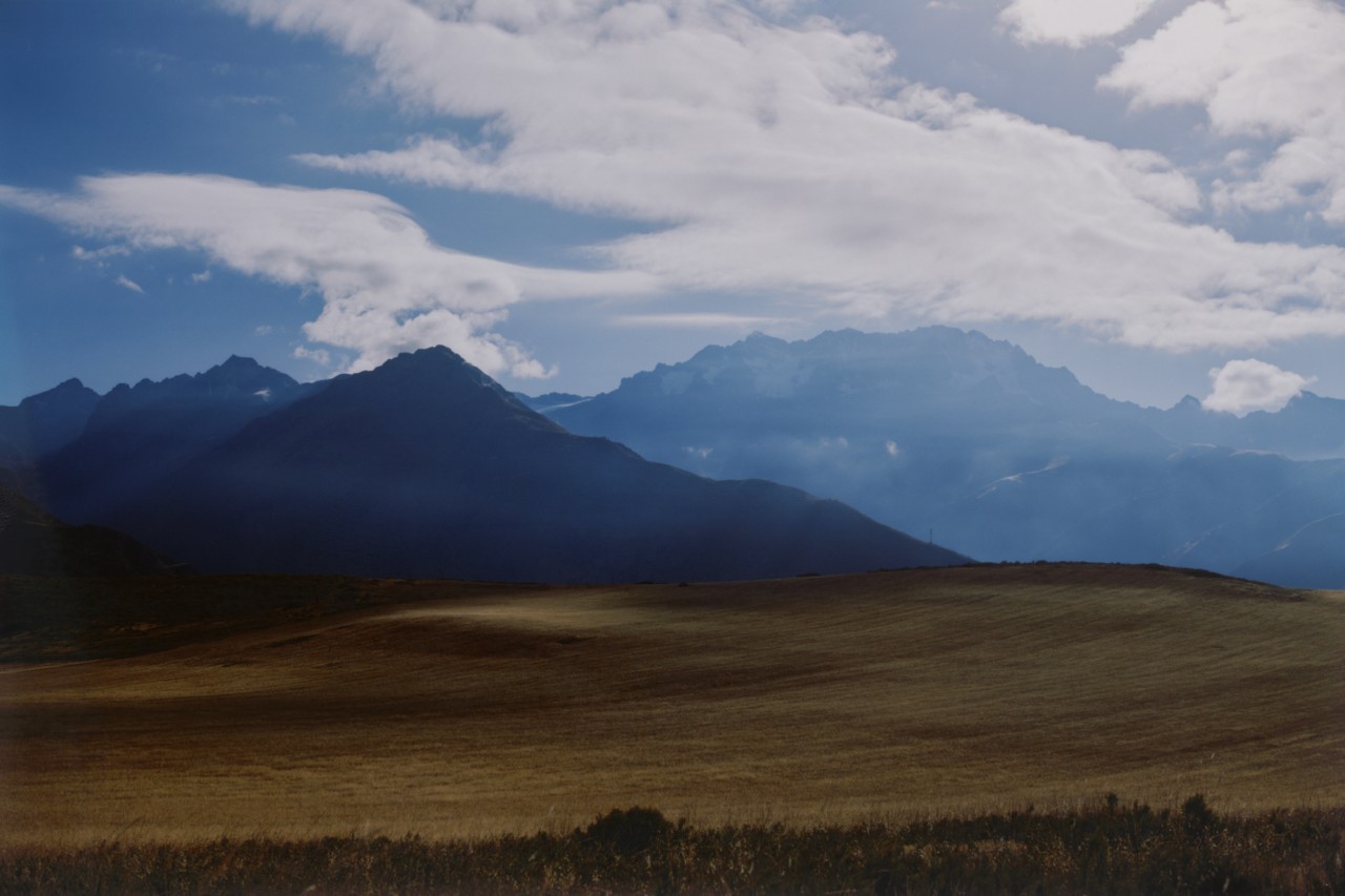 The clouds sit above the Andes mountain range