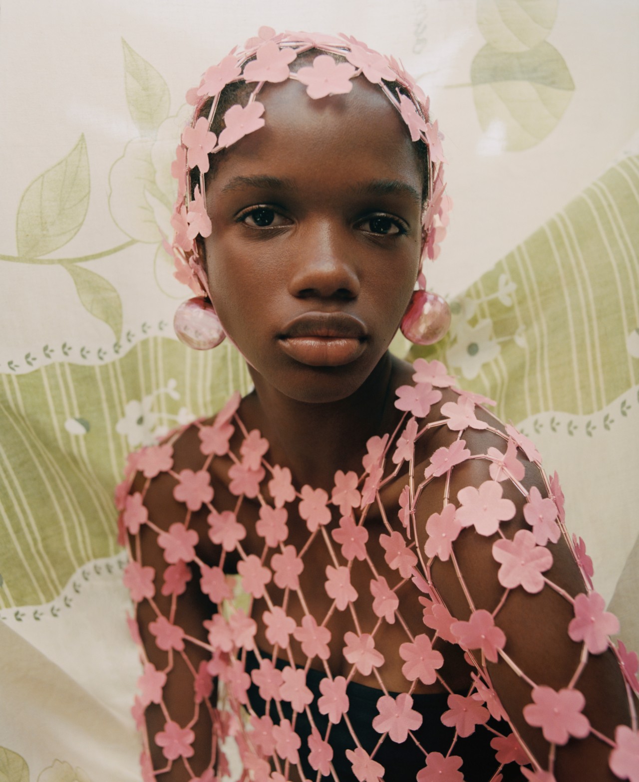 Woman in pink flower clothes, photographed by Nadine Ijewere