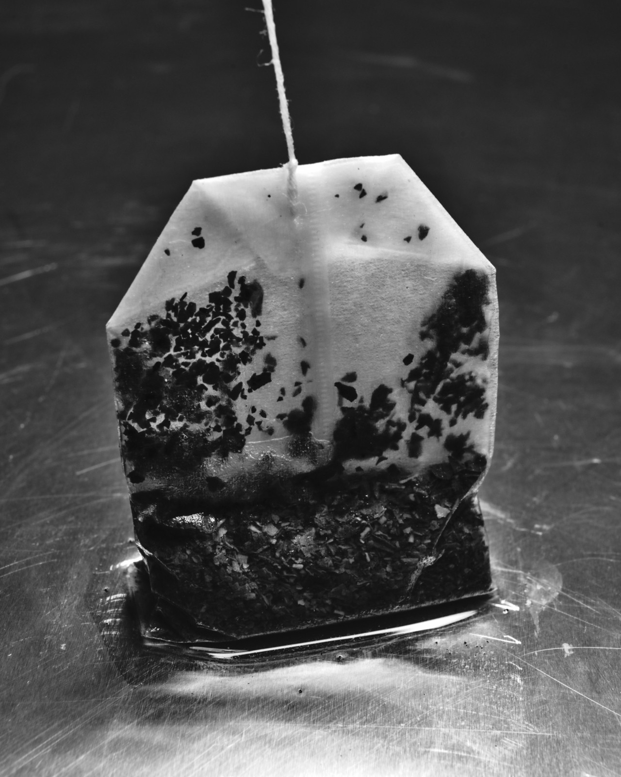 Black teabag photographed in black and white