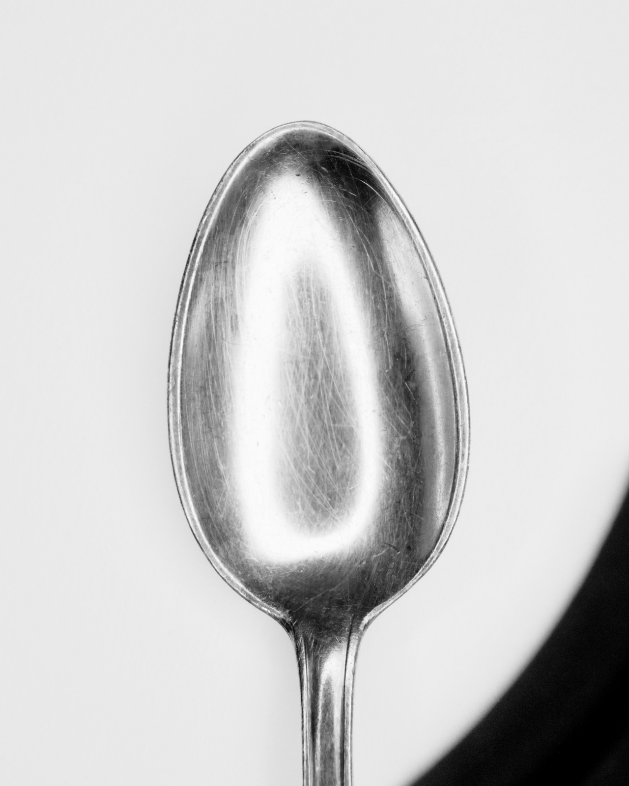 Silver spoon photographed in black and white